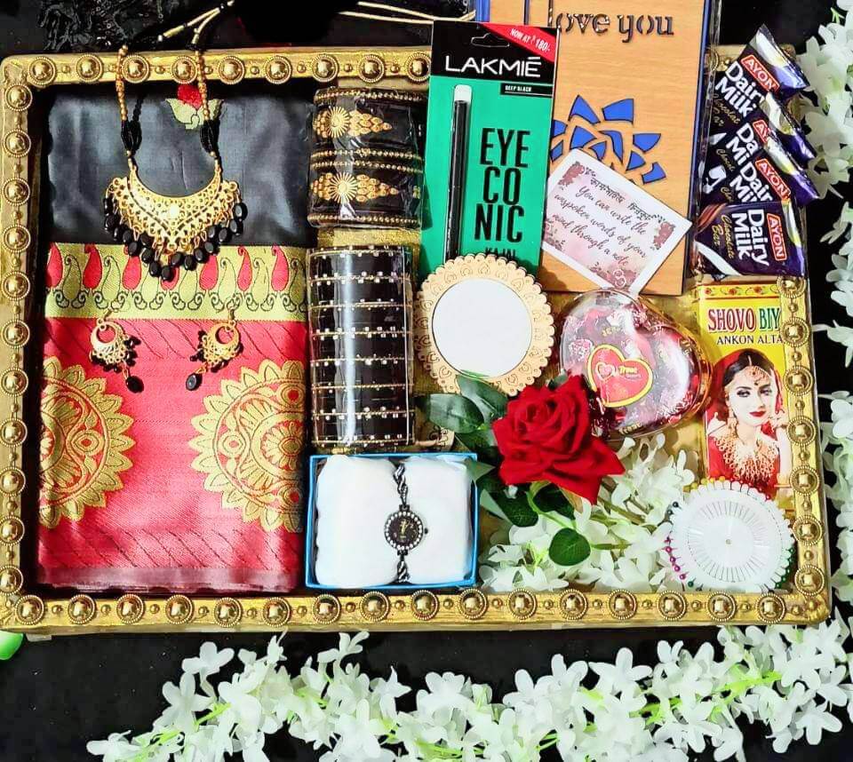 black katan , red pair saree